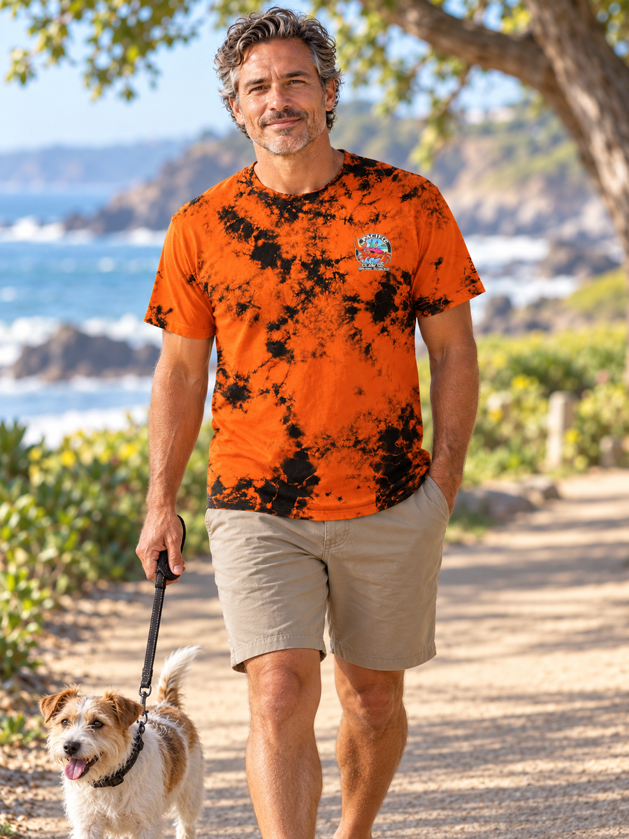 Second Wave Rust Tie-Dye T-Shirt — mature model in a relaxed coastal setting