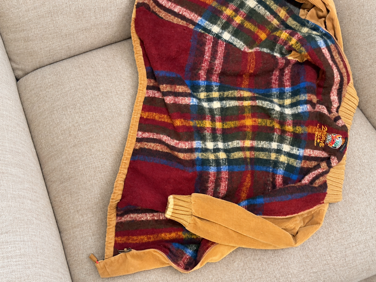 Corduroy coat on a soft beige couch — detail 5