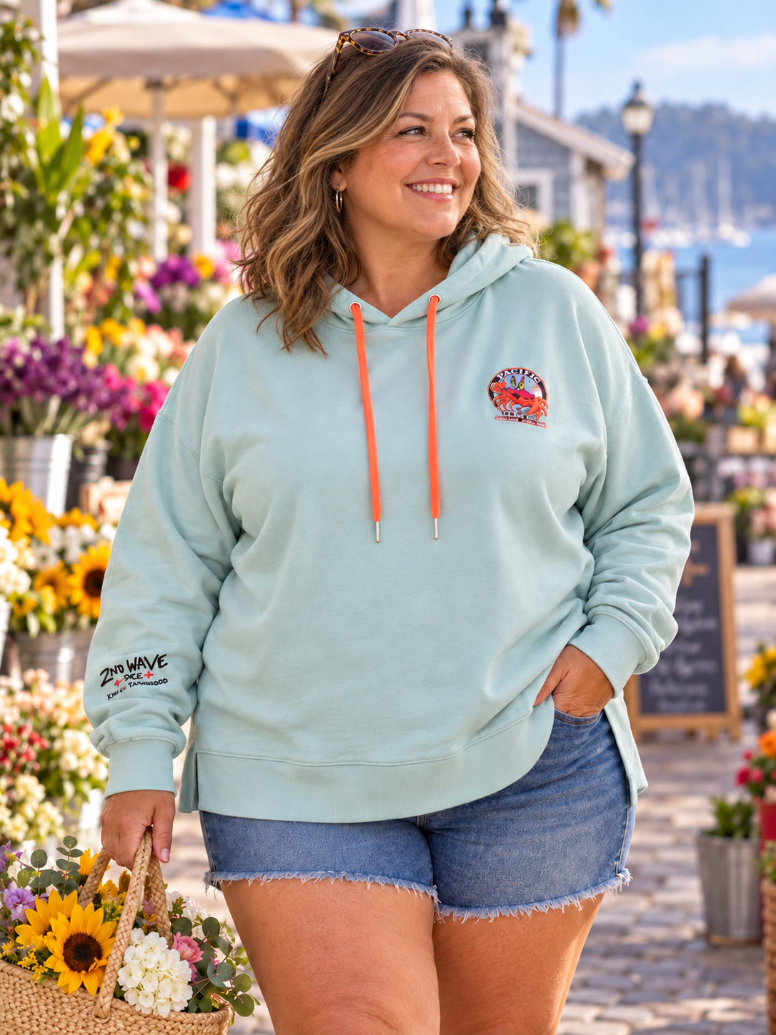 Second Wave Pale Blue Pura Vida Hoodie — Women's 3X — mature model in a relaxed coastal setting