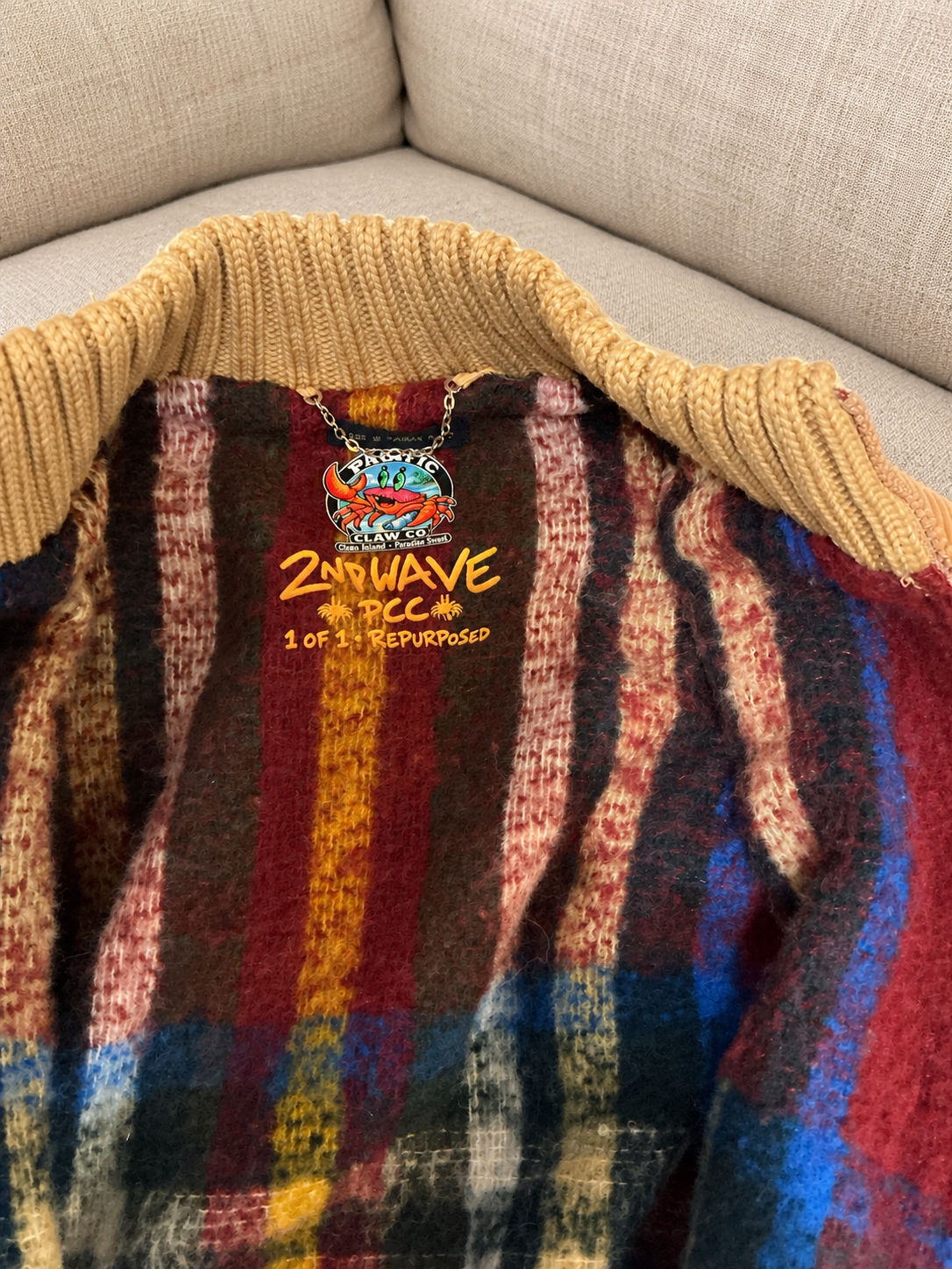 Corduroy coat on a soft beige couch — detail 2