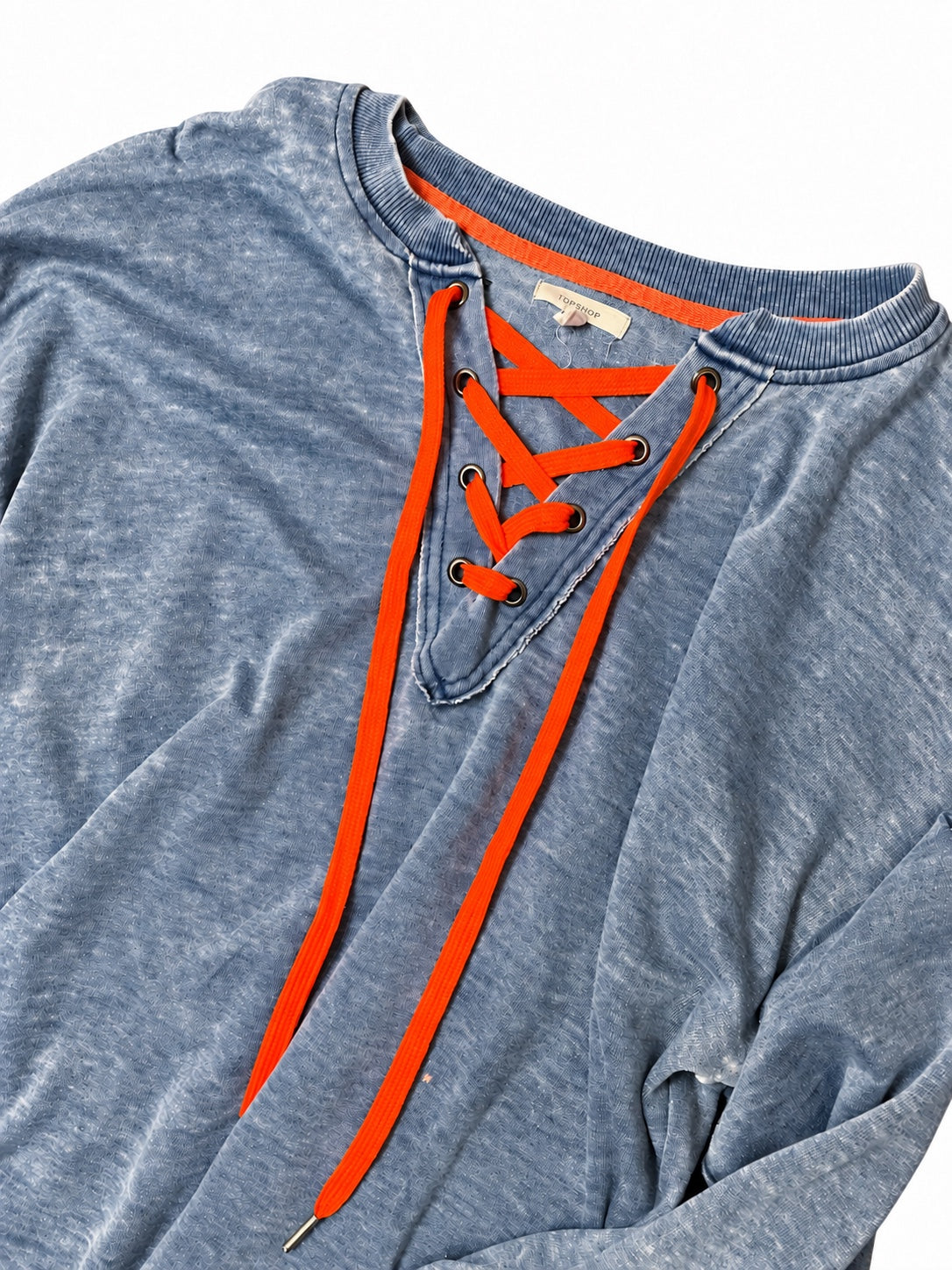 Blue lace-up pullover, neckline and orange laces