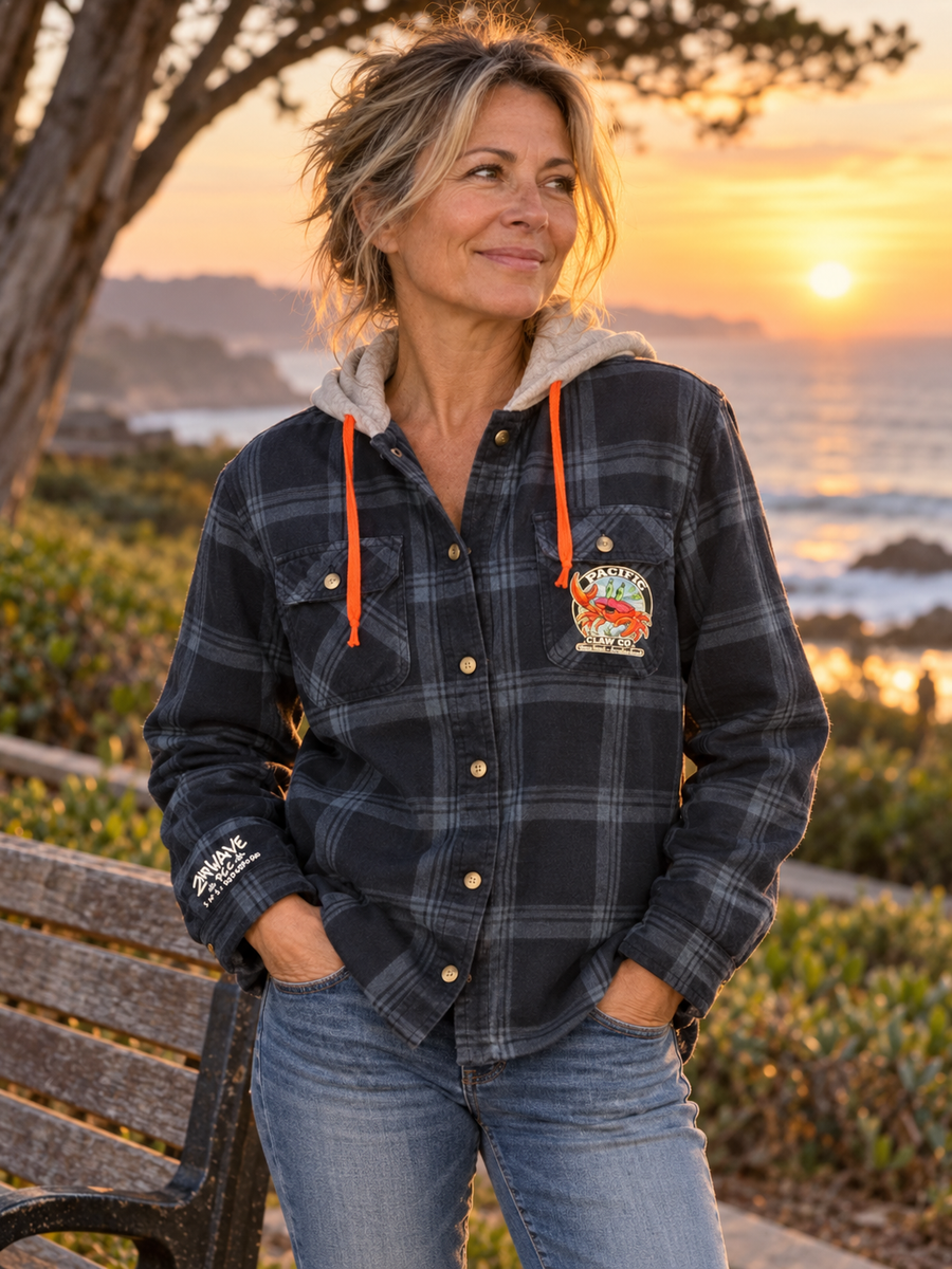 Woman wearing blue Wrangler plaid jacket in a park at sunset
